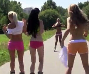 A gang of nude little girls shifts on rollers sans undies
