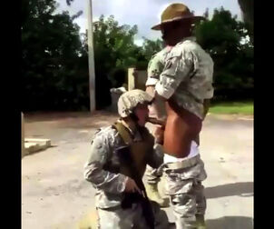 Soldier coerced to gargle dark-hued prick