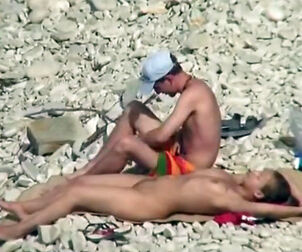 Naked dame with teeny funbags sunbathing