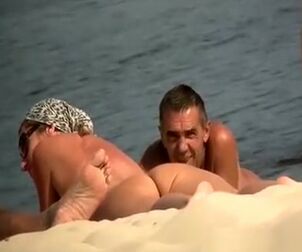 Spycam at naturist beach films naked fellows and gal